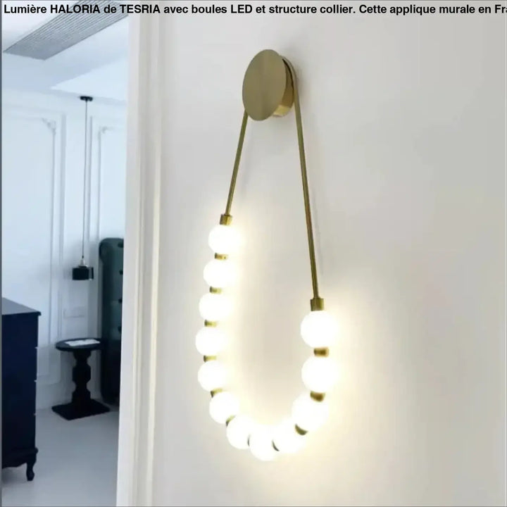 Applique murale haloria dorée en forme de collier de boules led avec sept ampoules sphériques pour une ambiance cosy