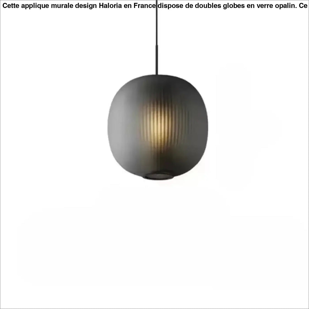 Suspension luminaire ovia sphérique gris foncé en verre nervuré avec texture verticale et lumière chaude intérieure
