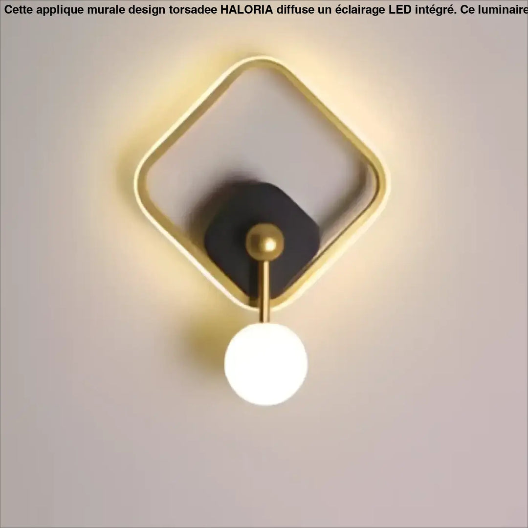 Applique murale haloria en métal doré avec centre circulaire noir et ampoule sphérique blanche design géométrique