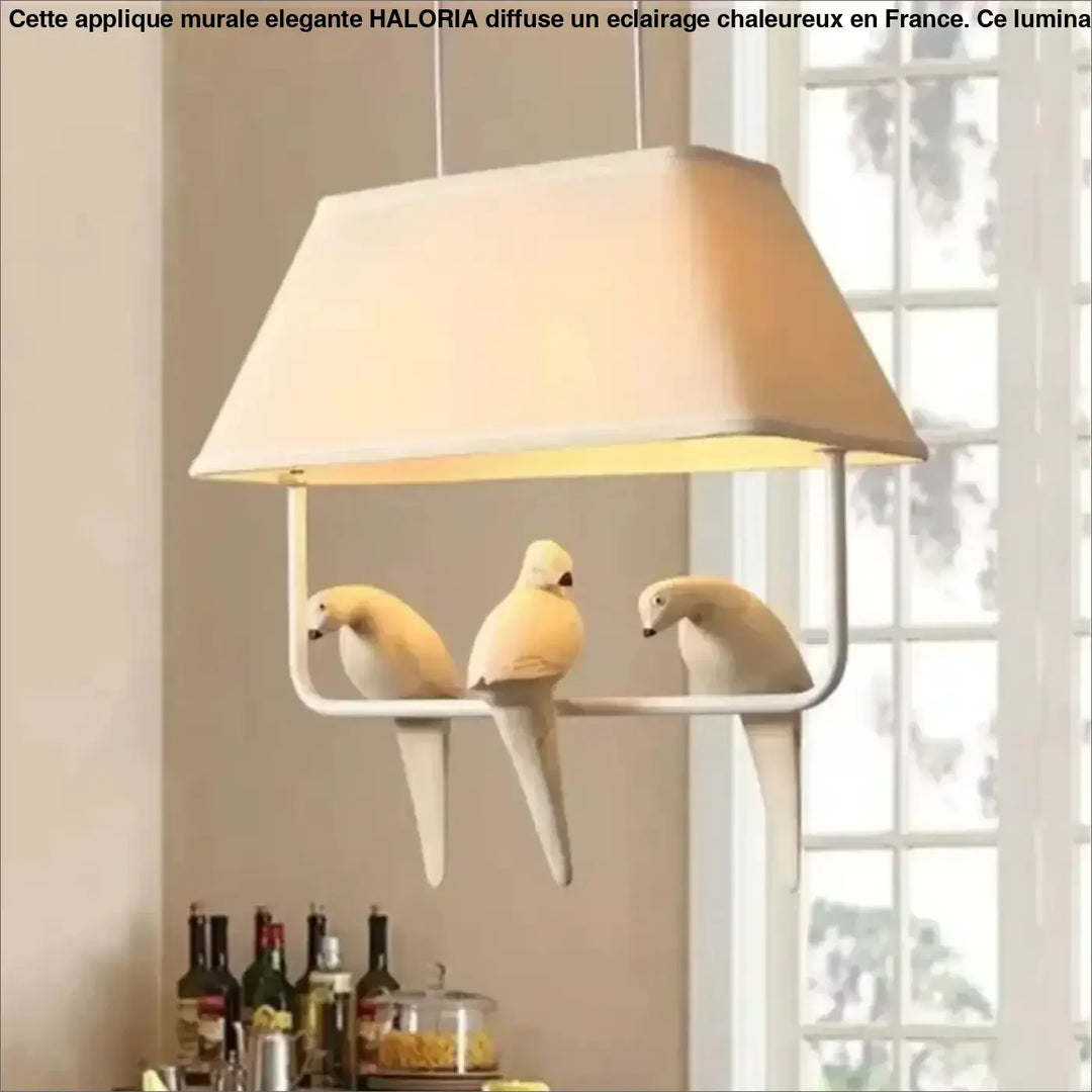 Suspension luminaire rectangulaire crème avec trois figurines d oiseaux blancs perchées sur son cadre lumibird