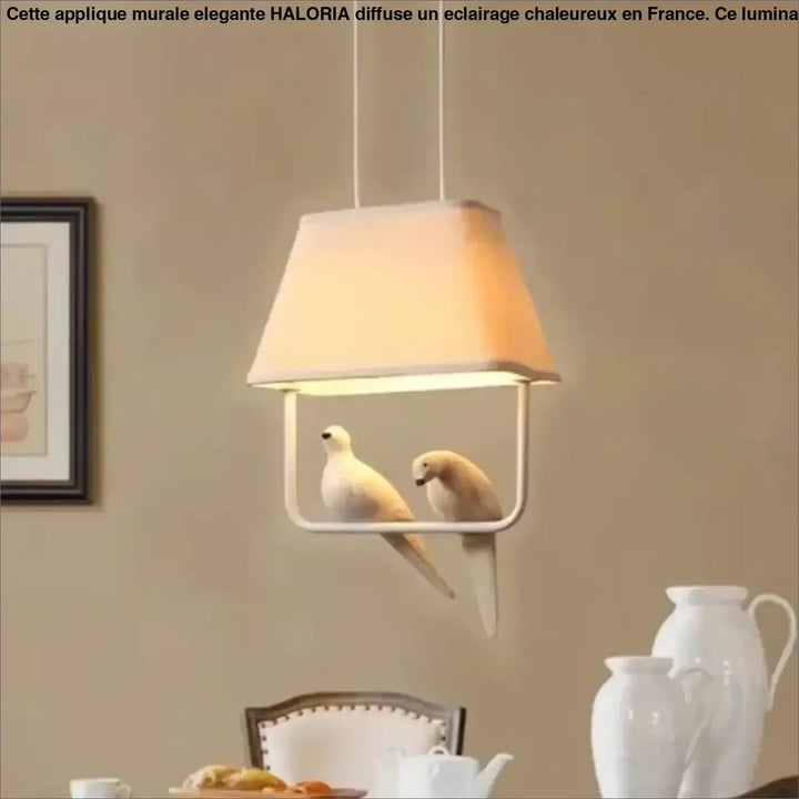 Suspension luminaire lumibird avec abat-jour en tissu blanc et cadre métallique minimaliste ornée de deux colombes sculptées