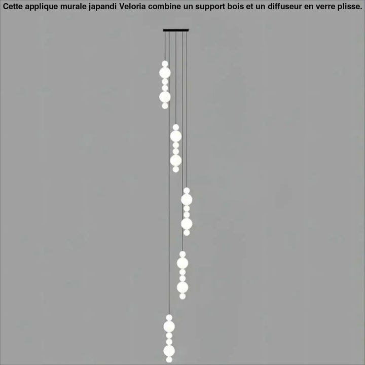 Suspension luminaire oxyo en forme de boule opaline blanche moderne avec cordons noirs minimalistes en chute verticale