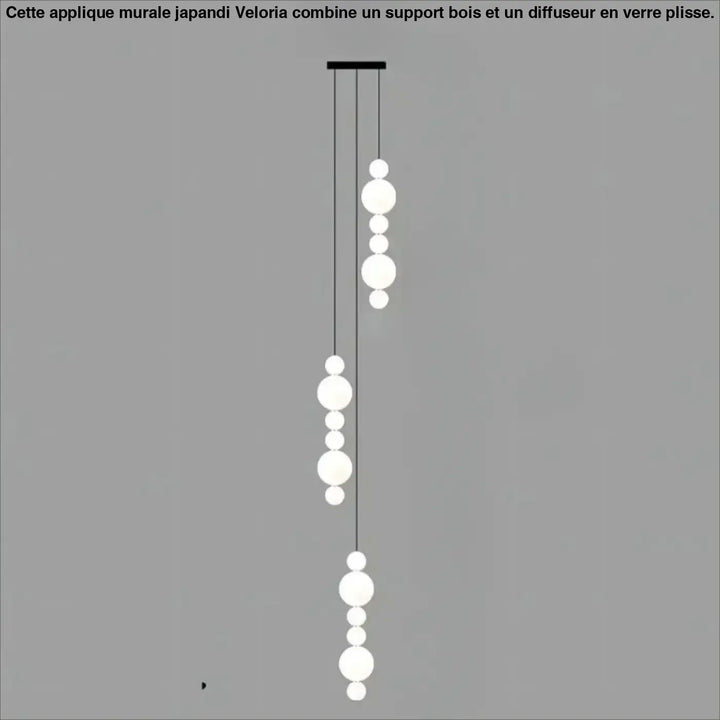 Suspension luminaire oxyo avec boules opalines blanches sphériques et chute verticale noire elegante pour plafond