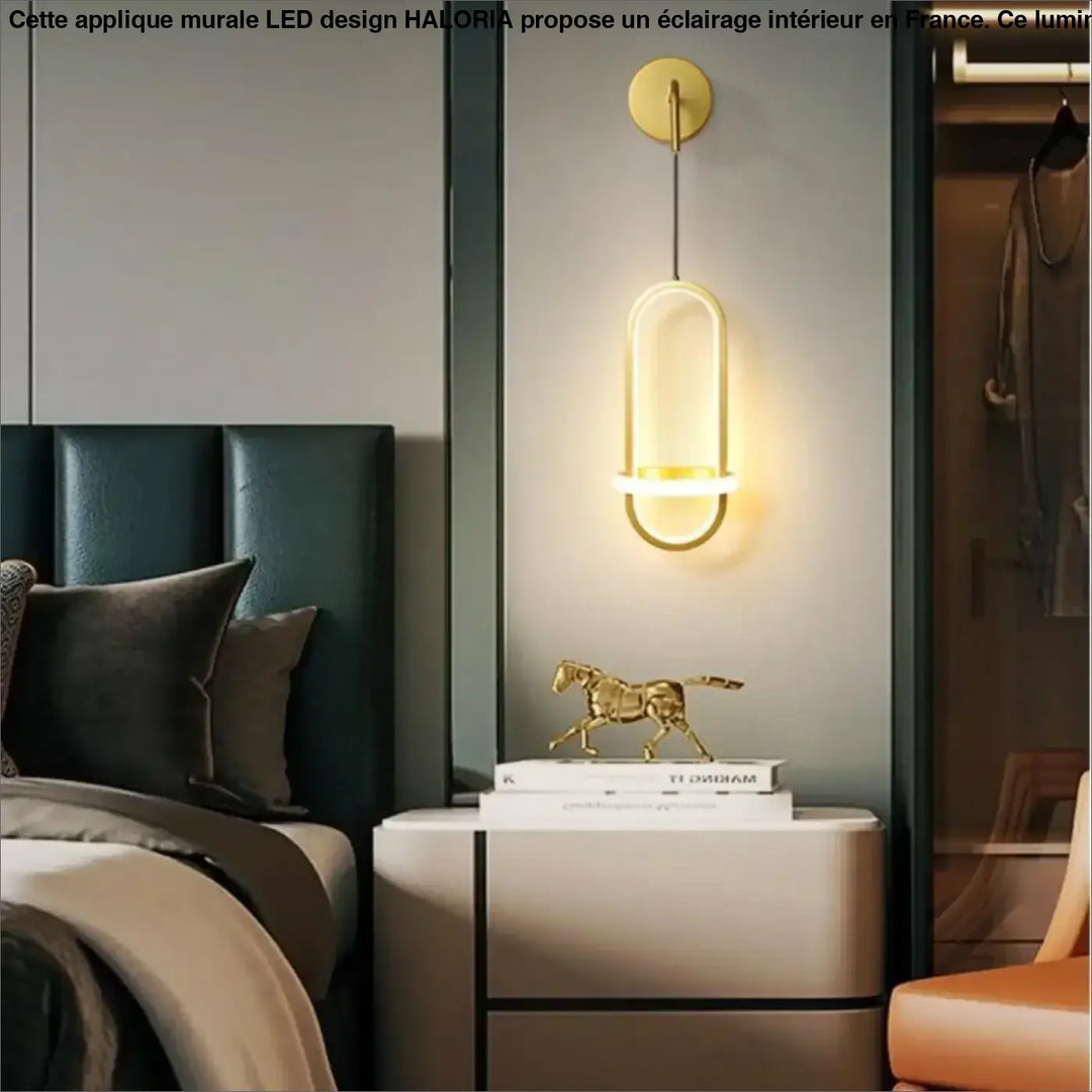 Applique murale led design haloria en métal doré avec forme ovale allongée et éclairage ambiant chaleureux moderne
