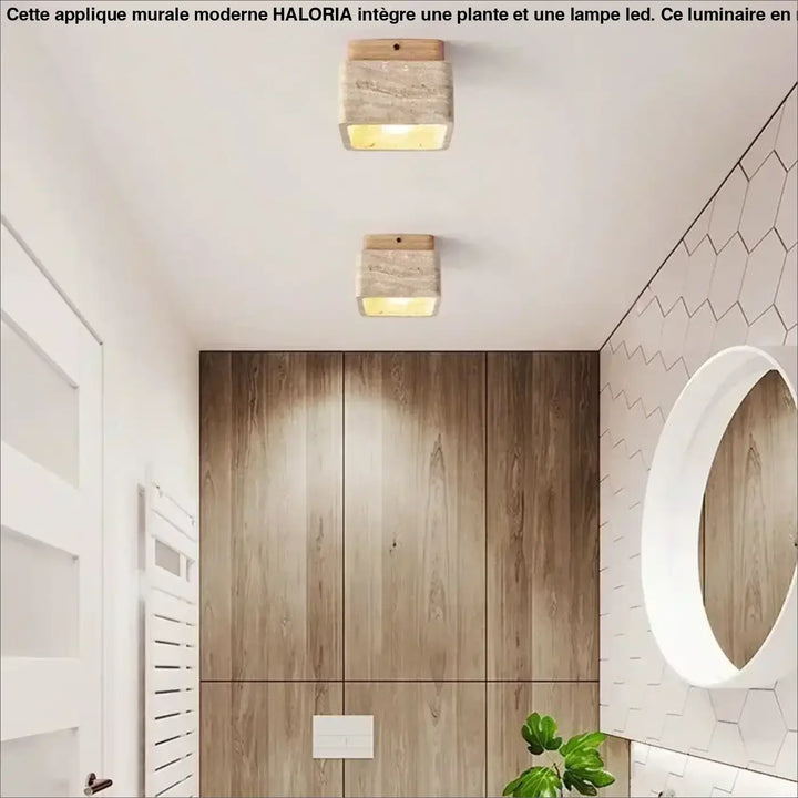 Luminaire plafonnier design avec bois naturel et corps texturé pierre, émettant une lumière chaude jaune pour décoration intérieure