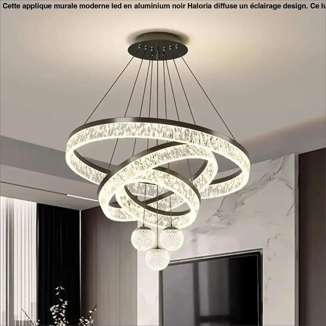 Applique murale moderne en aluminium noir avec anneaux en cristal entrelacés et trois orbes en verre suspendus haloria