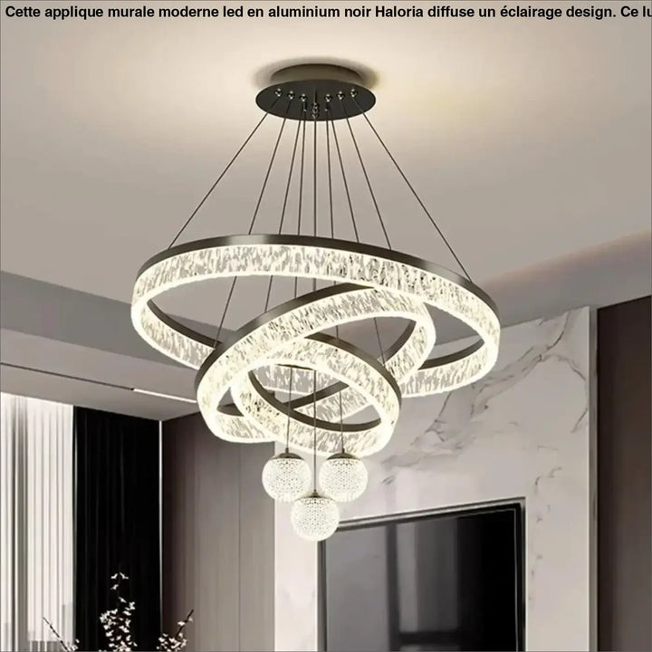 Applique murale moderne en aluminium noir avec anneaux en cristal entrelacés et trois orbes en verre suspendus haloria