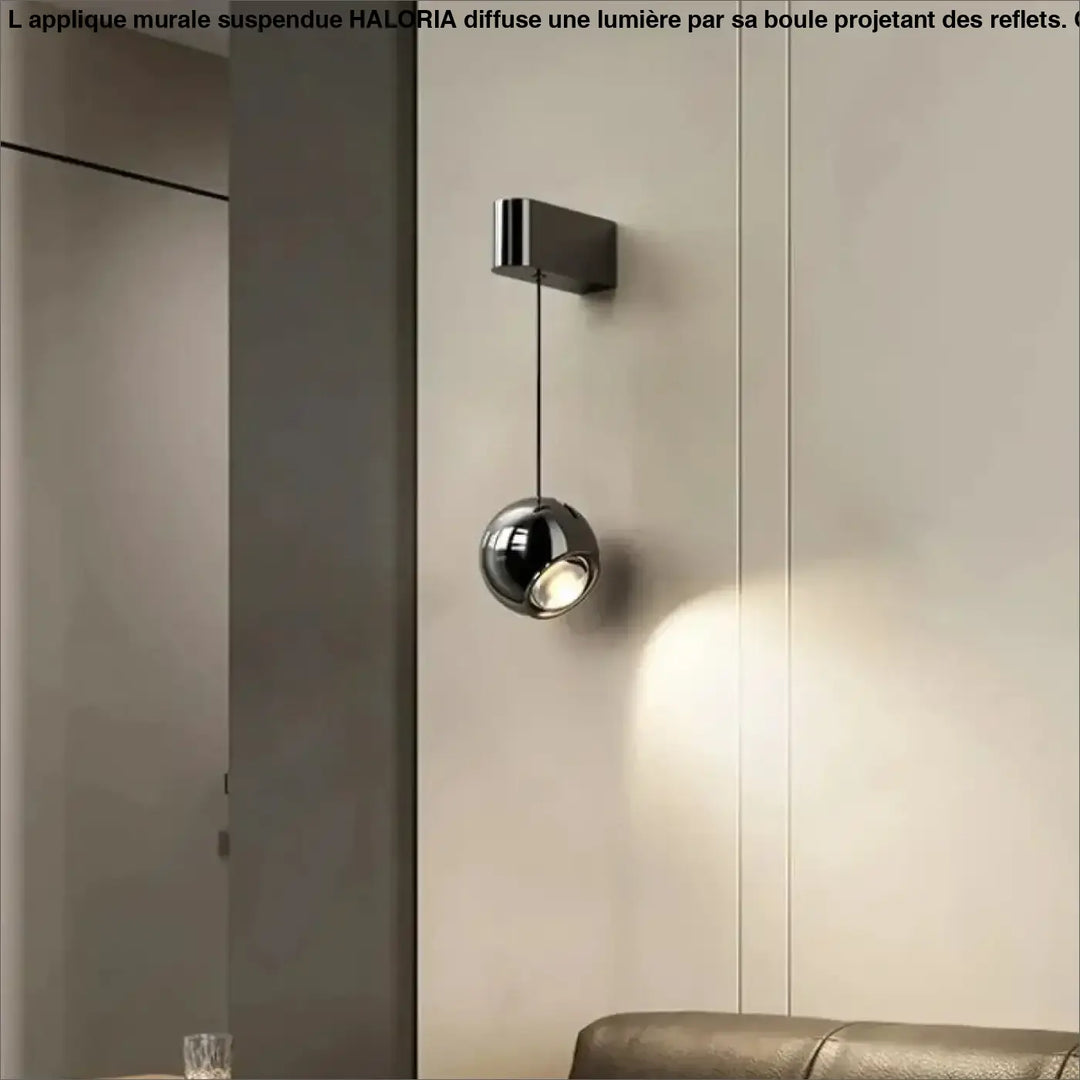 Applique murale suspendue avec une boule projetant la lumière


