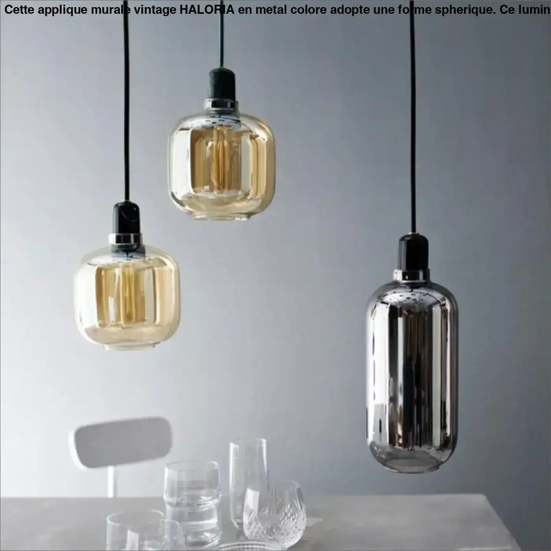 Suspension luminaire hyalis avec trois formes arrondies en verre teinté ambre et chrome suspendues par cordons noirs