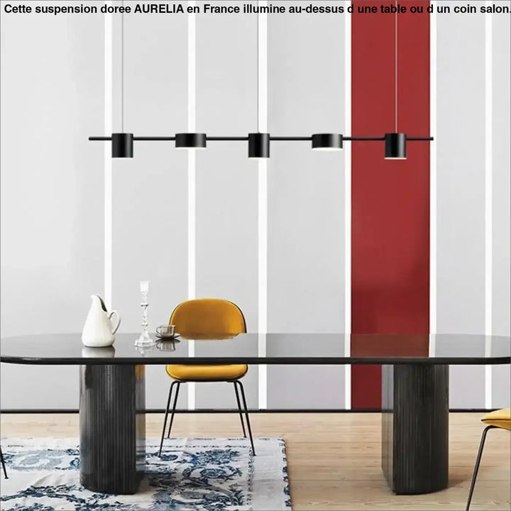 Suspension doree au-design minimaliste noir avec cinq cylindres linéaires au-dessus d’une table dining aurelia