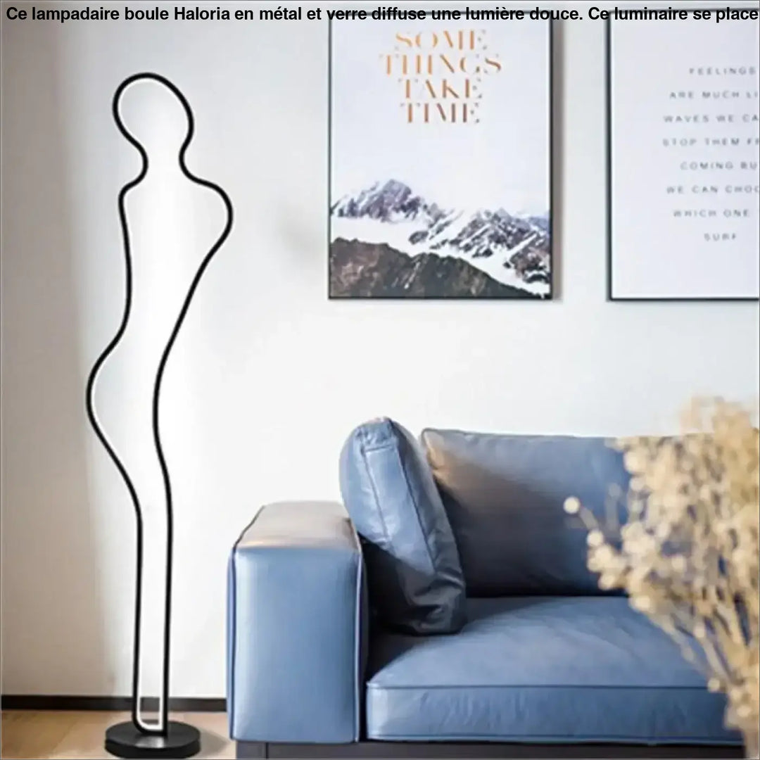 Lampadaire boule sur pied haloria silhouette filaire noire en forme de figure humaine idéal côté d’un canapé