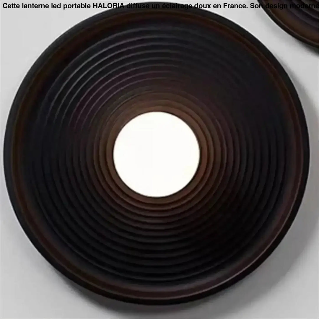 Applique murale vertigo circulaire brun foncé avec lumière douce centrale et design élégant à anneaux concentriques