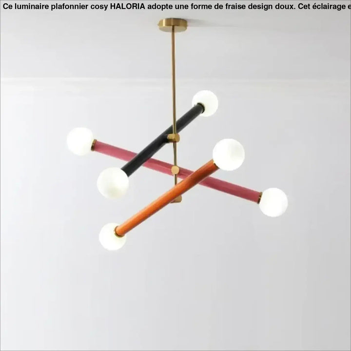 Suspension luminaire tsara avec tubes géométriques noirs, roses et bois tenant des globes en verre dépoli pour lumière diffuse