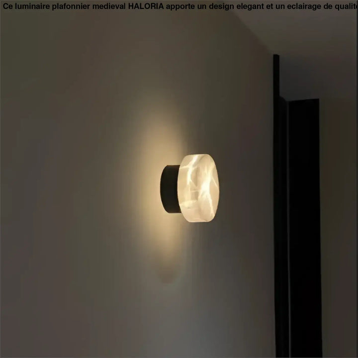 Applique murale design laurelLe avec diffuseur en marbre blanc translucide et base cylindrique noire pour lumière décorative moderne