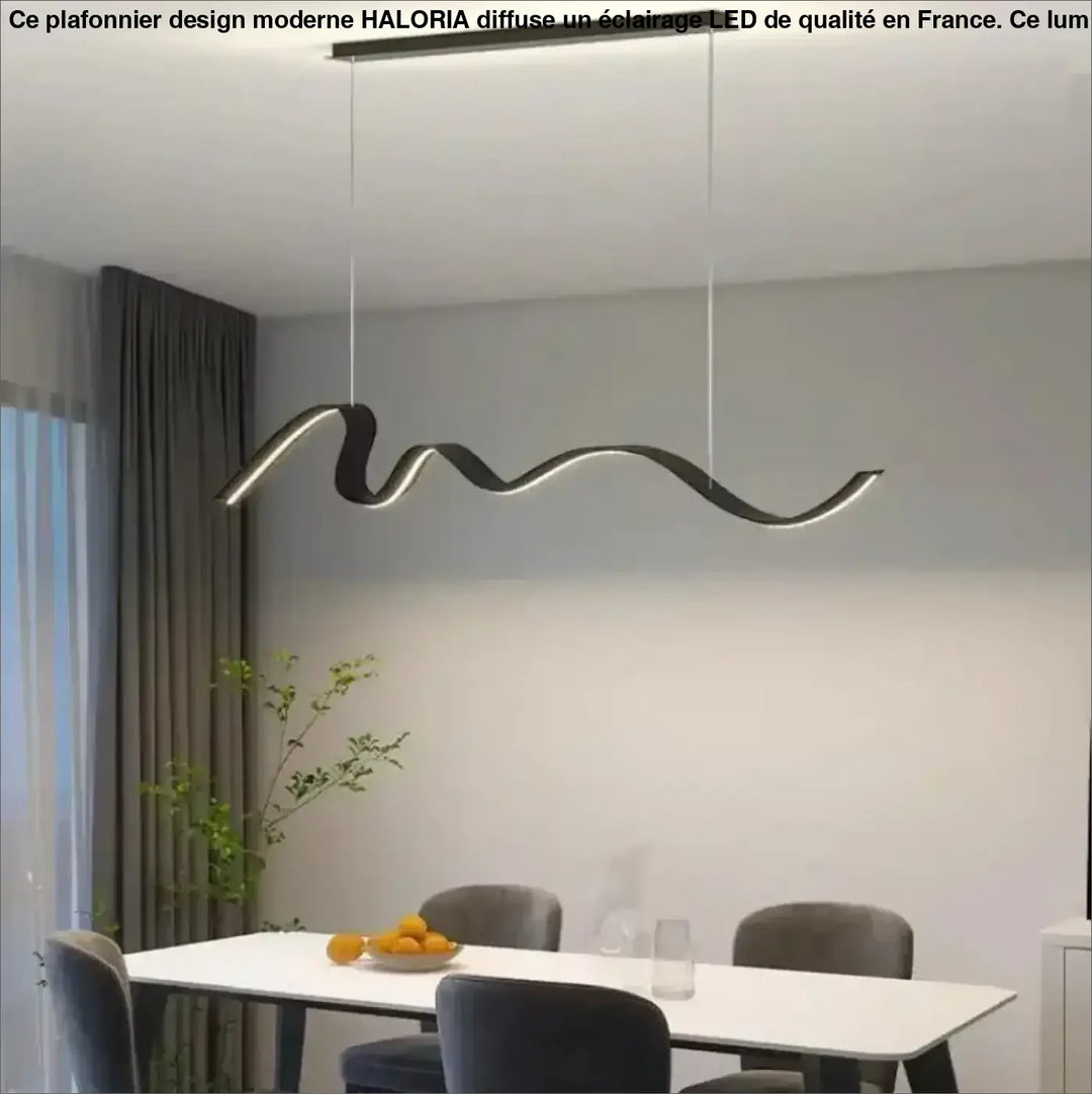 Suspension luminaire olaka noir en led ondulée avec design minimaliste suspendue au-dessus d’une table à manger