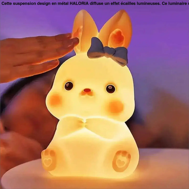 Veilleuse lapin girly ostara en forme de lapin jaune doux avec noeud bleu et coeurs sur les pattes
