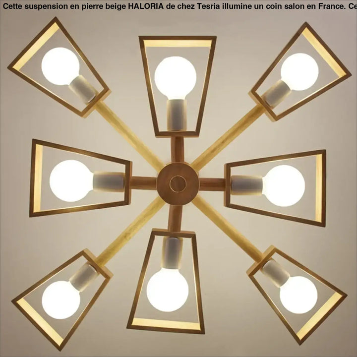 Suspension design en pierre beige forme dome moderne avec huit luminaires géométriques en laiton au-dessus d’une table