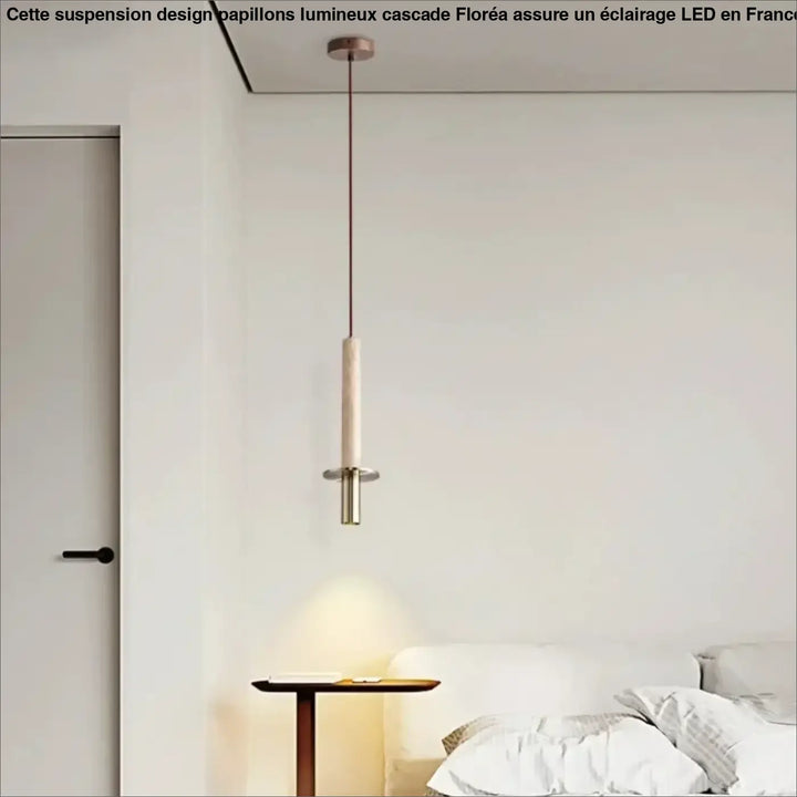 Suspension design moderne avec tige en métal et abat-jour cylindrique

