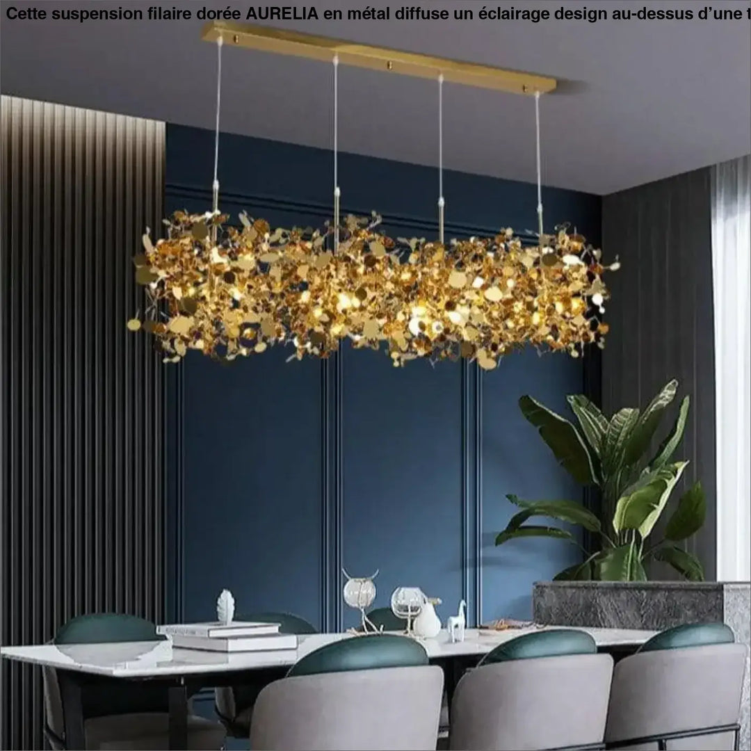 Suspension filaire dore aurelia avec cadre rectangulaire moderne et feuilles metalliques dorees pendantes