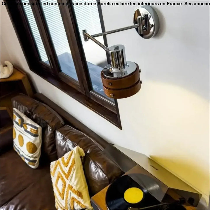 Chrome-finished suspension led contemporaine doree with adjustable wall sconce and circular wooden base by aurelia