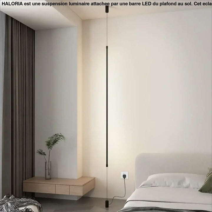 Suspension luminaire attachée au plafond au sol par une barre LED

