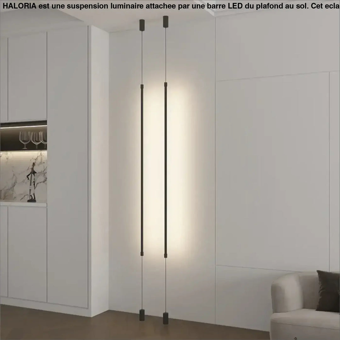 Suspension luminaire attachée au plafond au sol par une barre LED
