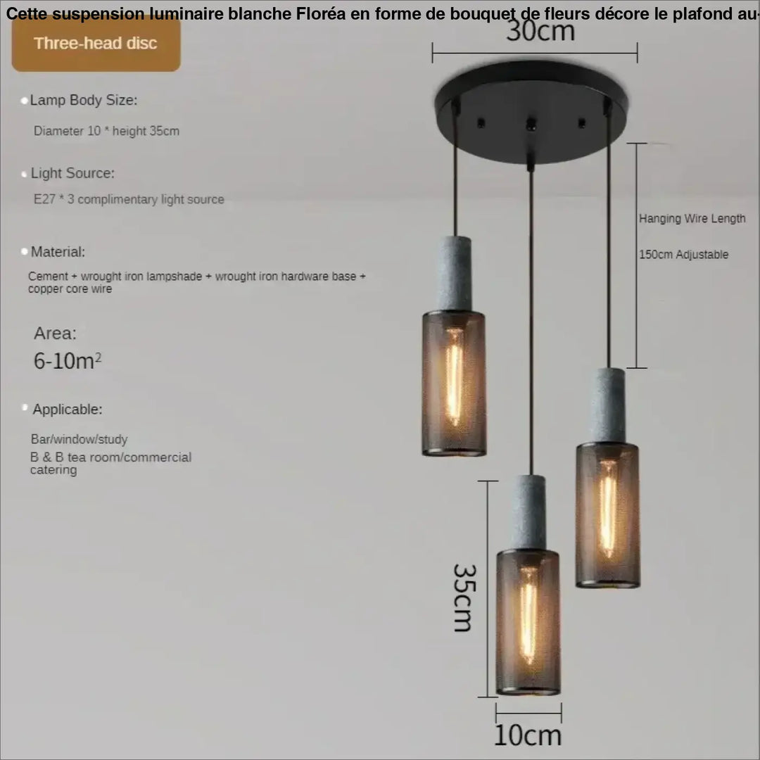 Suspension luminaire blanche floréa avec trois abat-jours en verre ambré style industriel en ciment et fer forgé