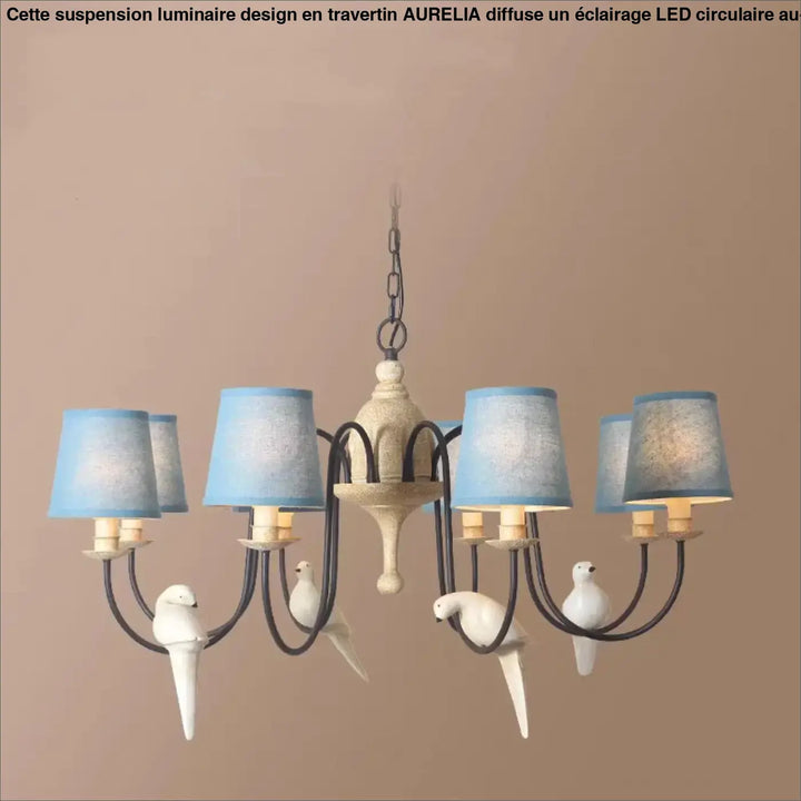 Suspension luminaire design circulaire led style travertin aurelila avec cadre métal blanc et oiseaux blancs au-dessus d’une table