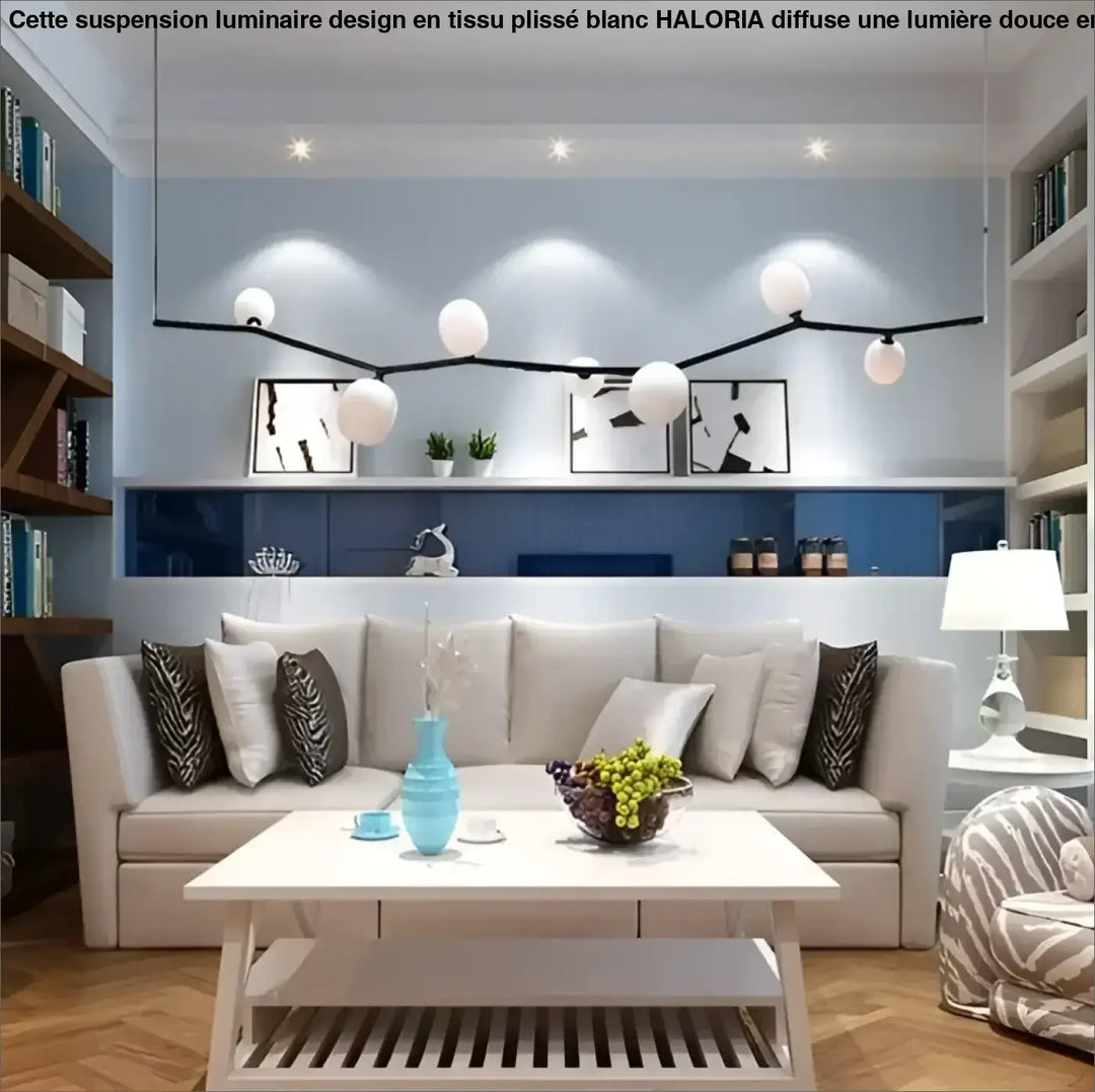 Light blue ceramic vase on white coffee table complementing suspension luminaire design tissu plisse blanc by haloria