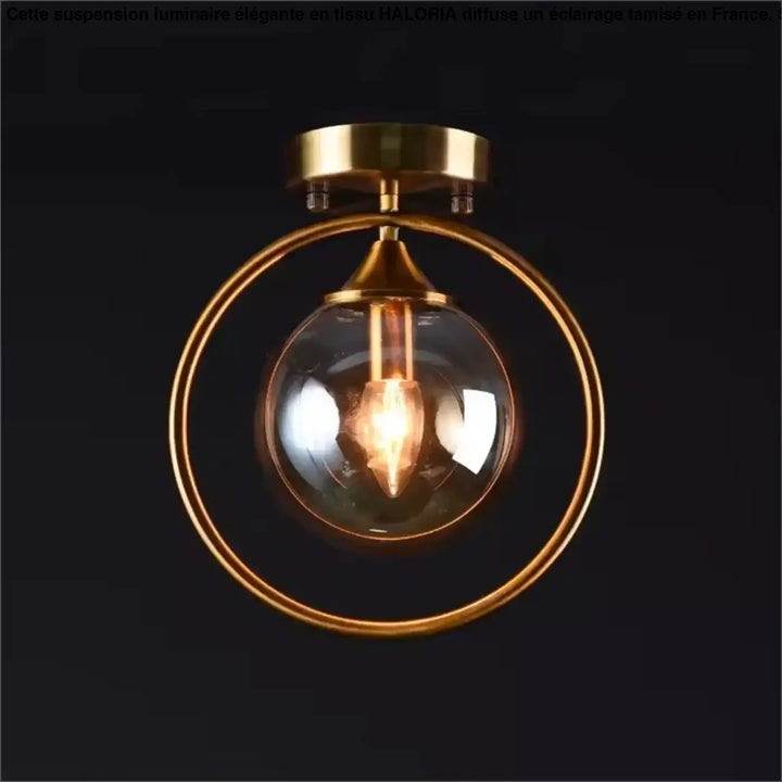 Luminaire plafonnier celliah en laiton avec globe en verre clair et ampoule à filament apparent