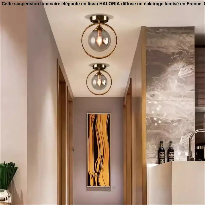 Luminaire plafonnier celliah avec deux cadres circulaires en laiton et globes en verre clair modernes