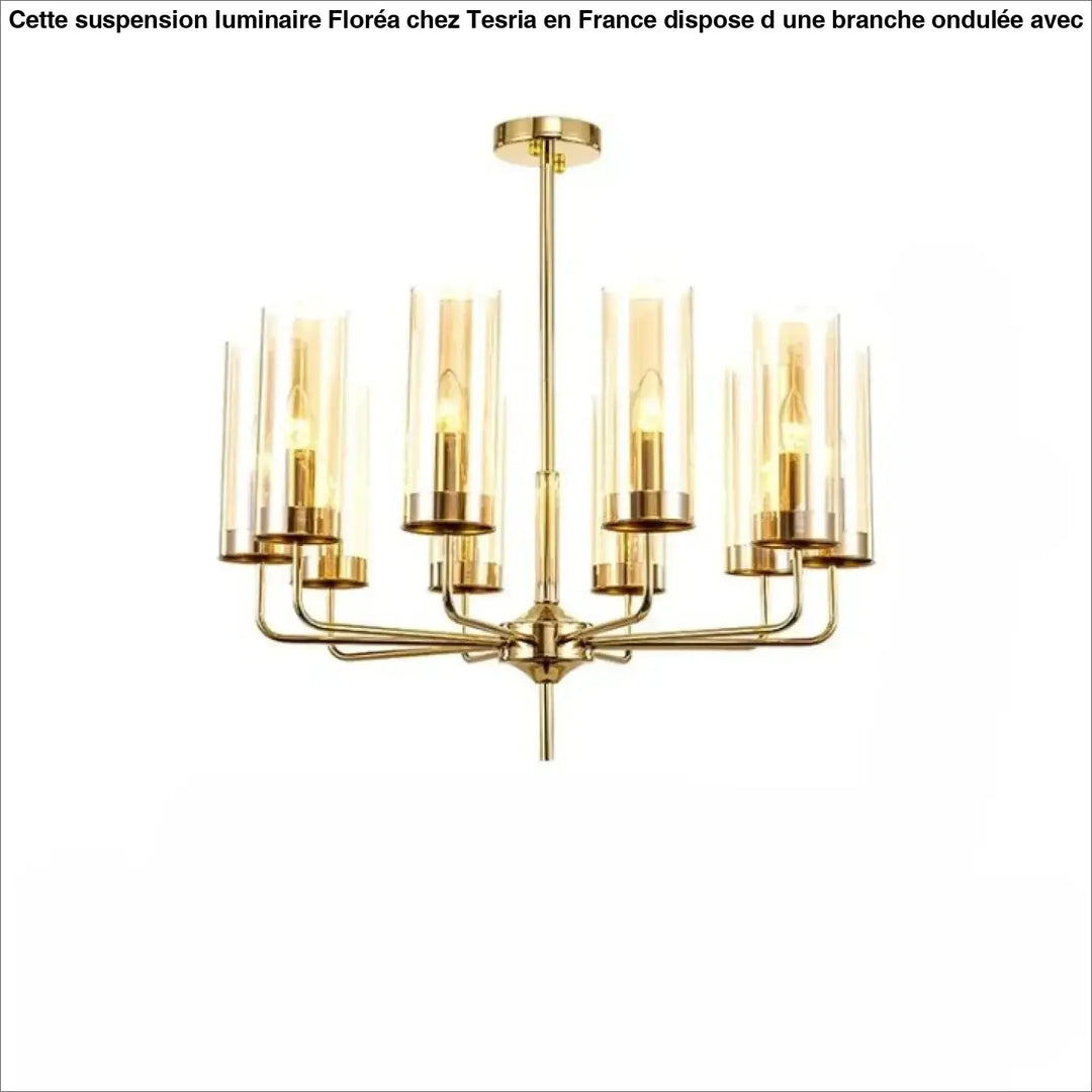 Lustre organisis est un élégant chandelier doré avec cylindres en verre nordique et accents en laiton