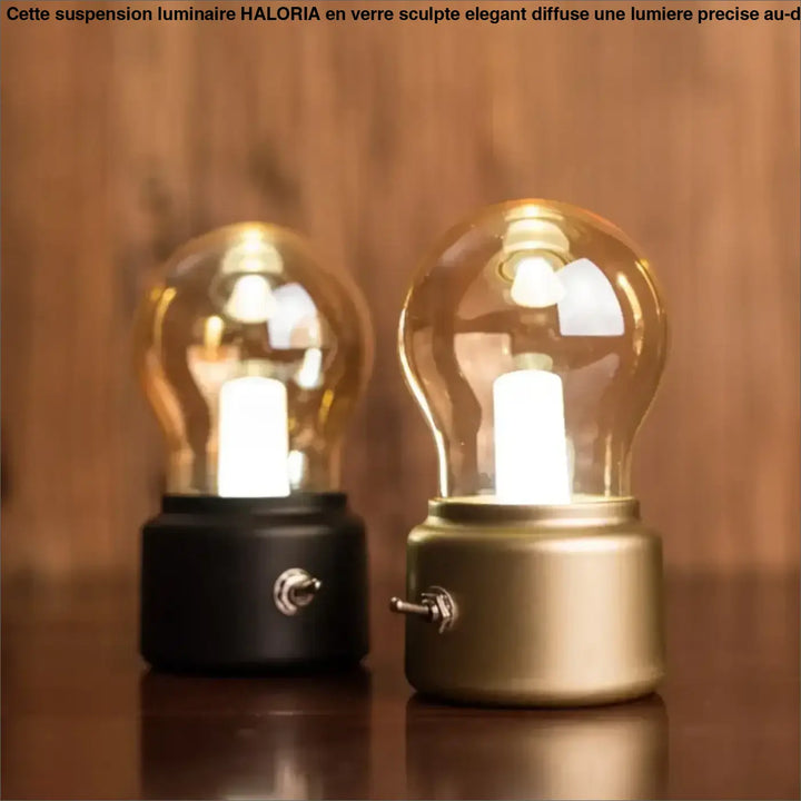 Lampe de table vintora vintage avec cloche ambrée verre clair et base métallique noire et dorée décoration intérieure élégante