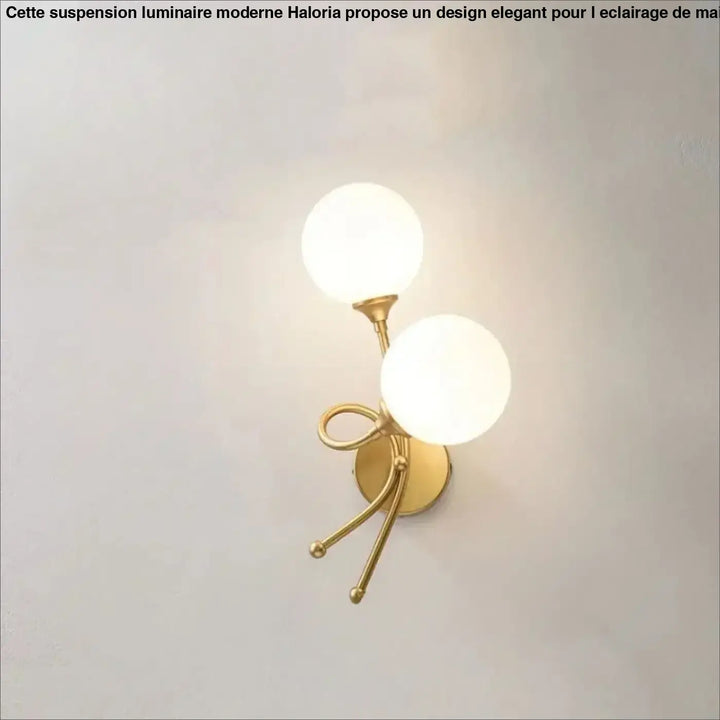 Applique murale zylo en métal doré avec deux globes en verre dépoli et base décorative en forme de nœud