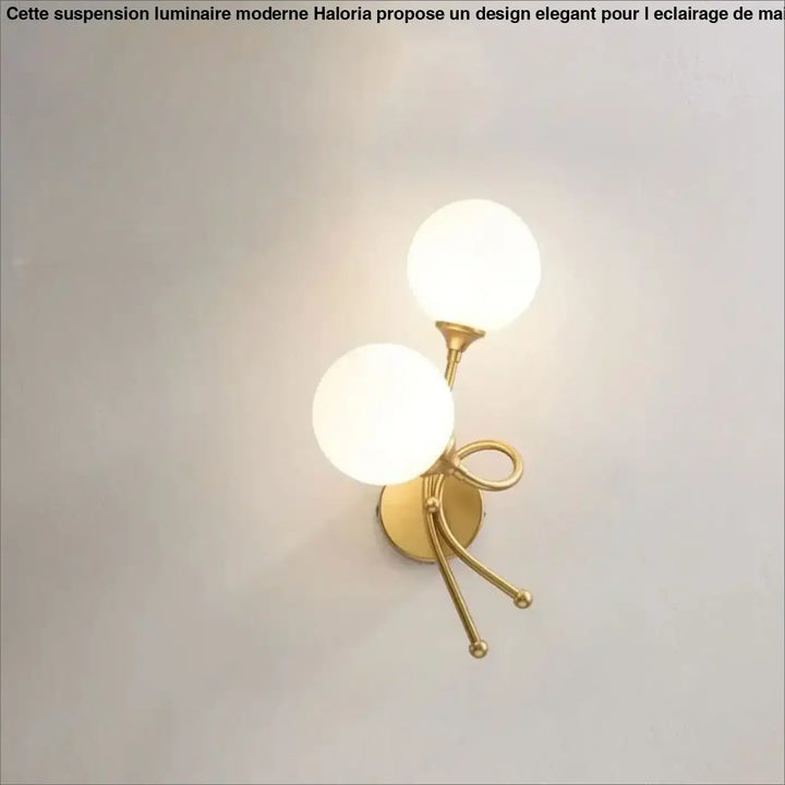 Applique murale zylo en métal doré avec deux globes en verre dépoli et un design en forme de nœud décoratif