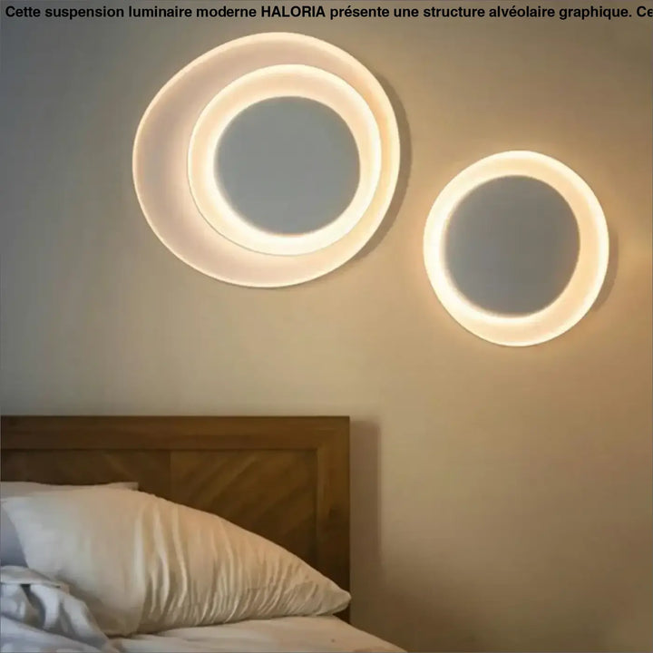 Deux appliques murales novae cercles sculptés avec un design murale moderne et une lueur chaude des anneaux lumineux