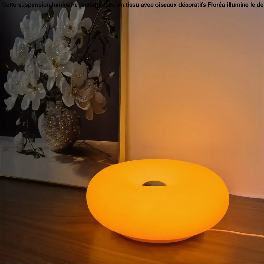 Lampe de table hausia orange circulaire avec finition mate et trou central pour gestion des câbles design unique idéale cadeau originale