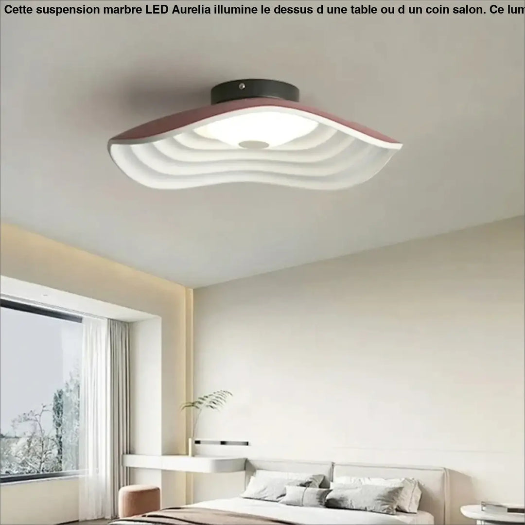 Suspension marbre design aurelia avec lumière led moderne au-dessus d’une table ou d’un coin salon blanche aux bords roses