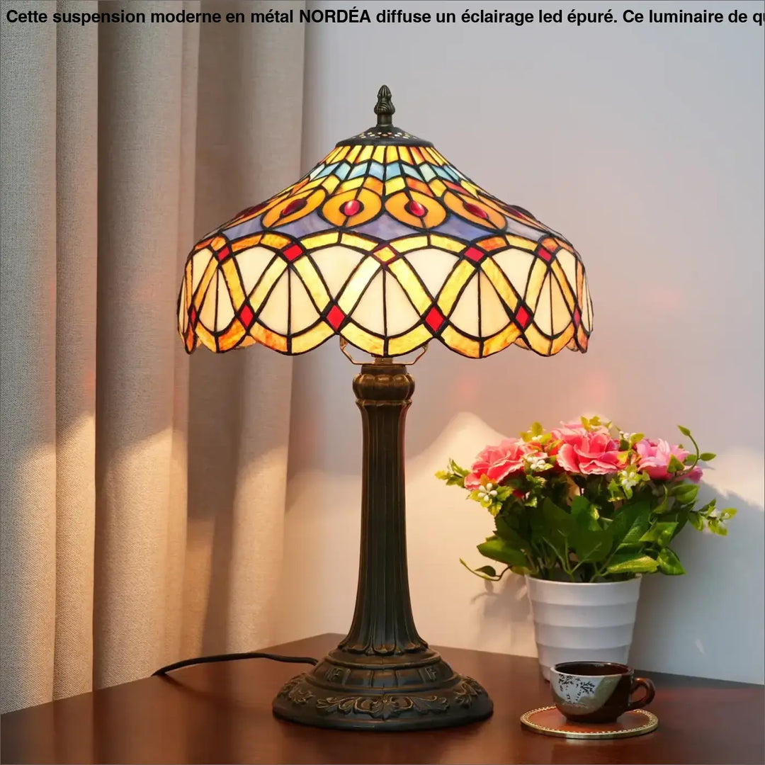 Lampe de table Nanih style vintage avec abat-jour en verre teinté coloré motifs géométriques jaune orange rouge bleu