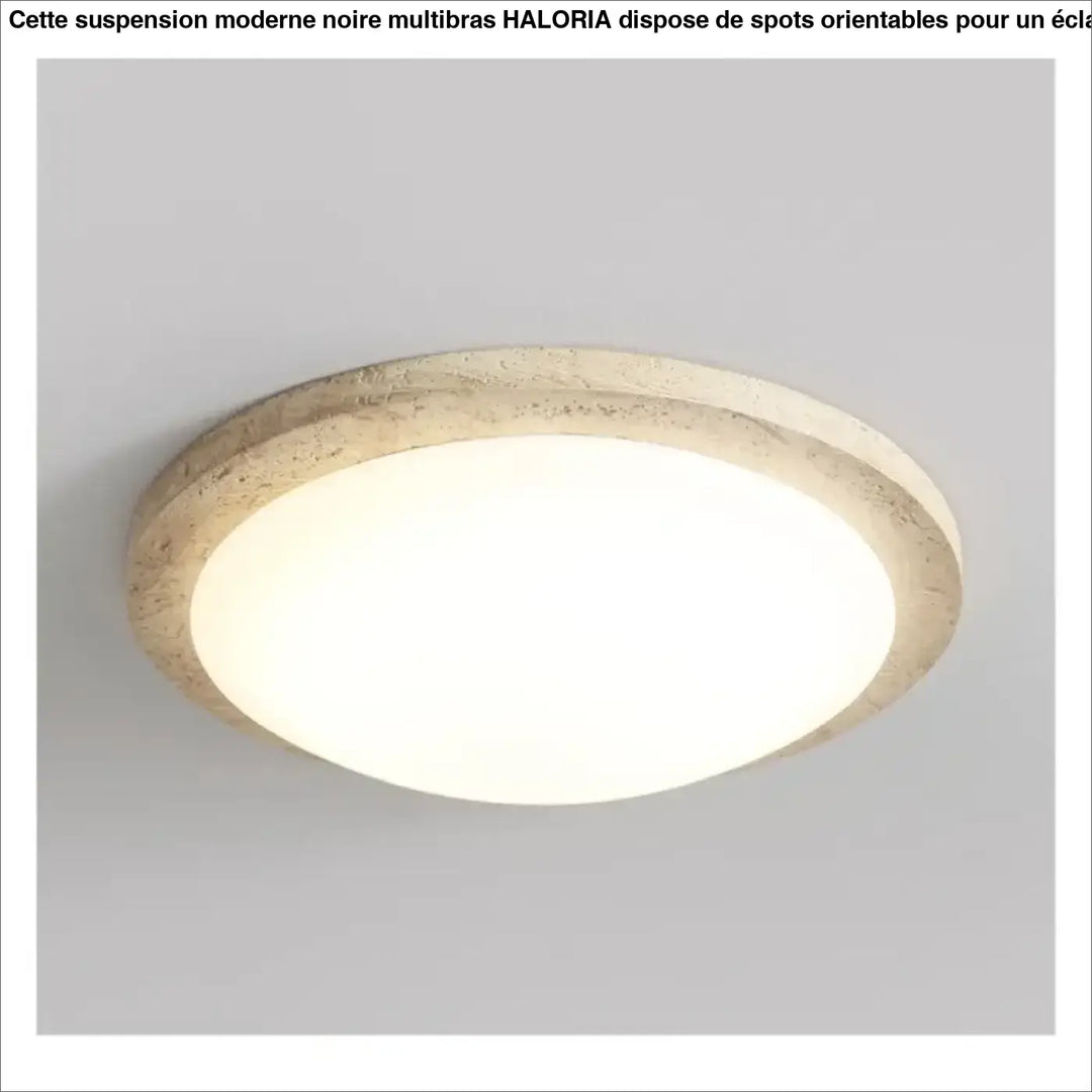 Suspension moderne noire multibras avec spots orientés présentant un diffuseur blanc lisse et cadre texturé beige pierre