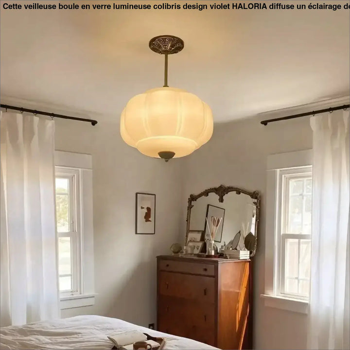 Suspension luminaire cream color softly glowing with vintage brass fixture and segmented glass shade for décoration intérieure art déco