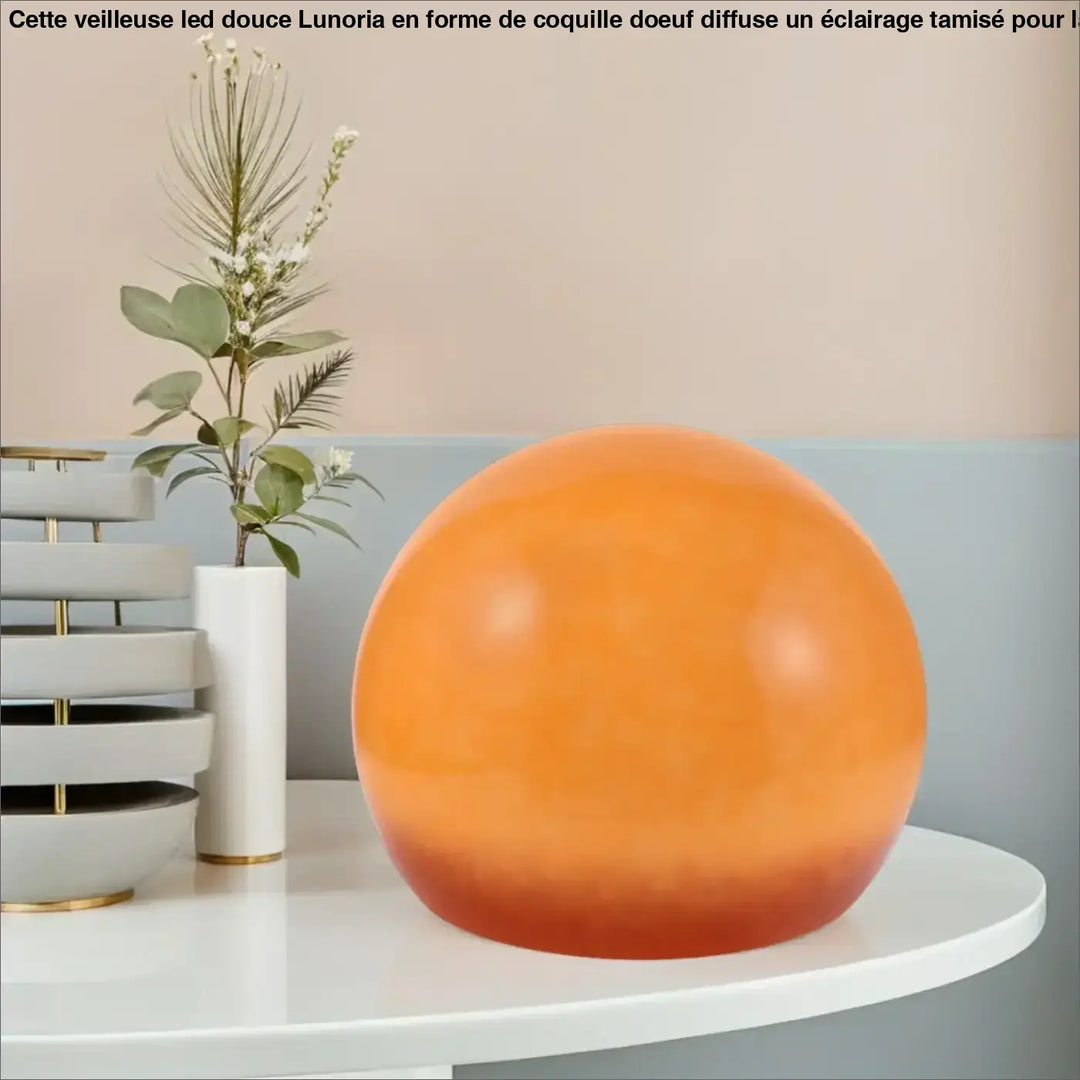 Lampe de chevet mars sphère orange lisse avec finition translucide apportant une lumière douce et une touche d’élégance